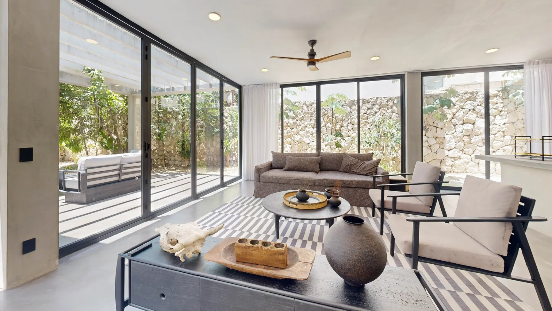 Open living room with floor-to-ceiling windows